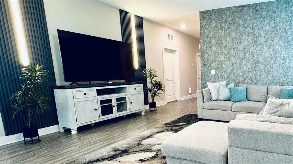 Open-concept living and dining area, fully furnished and designed for comfort and entertaining.