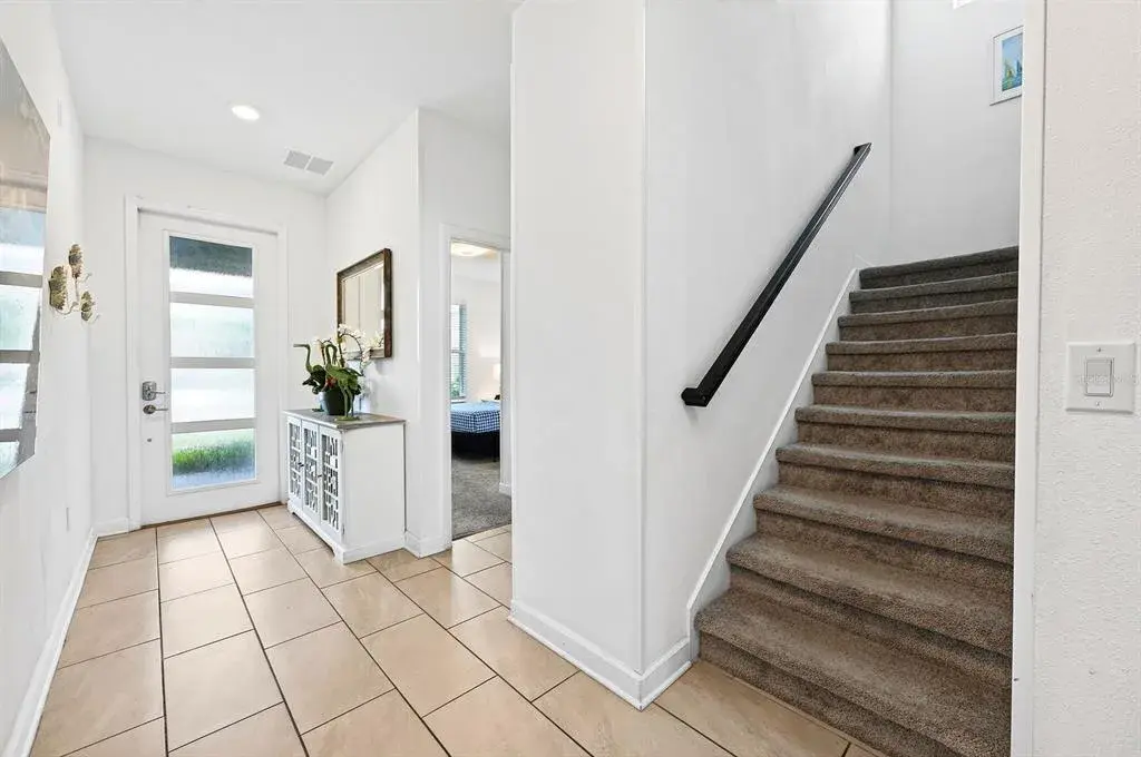 From the moment you enter, the CERAMIC TILE FLOORING and modern finishes create a fresh, inviting feel.