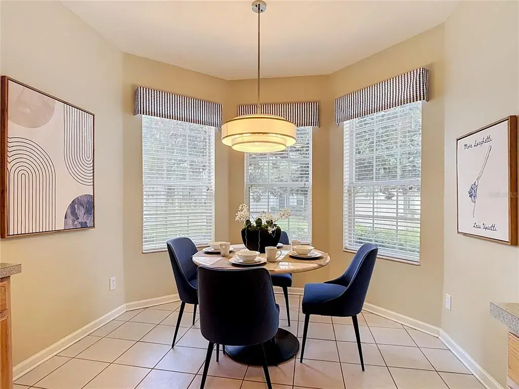 Bright breakfast nook with bay windows and plenty of natural light.