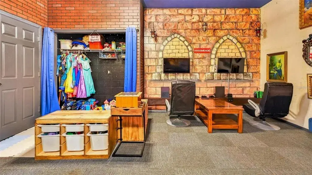 Game_room_closet_with_costumes_and_in_the_table_is_bins_with_toys