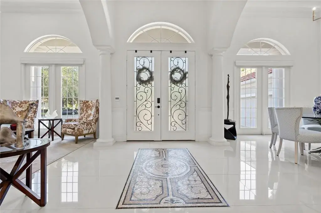 Gorgeous double door entry with custom tile inlay