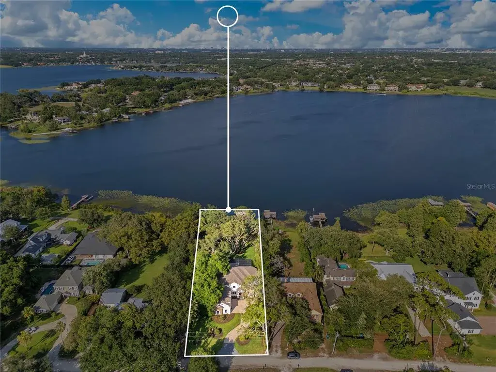 Huge Lot on Lake Bessie - Spring Fed Crystal Clear Water & White Sand Beach - Feels like having the Bahamas in Your Back Yard slide 1