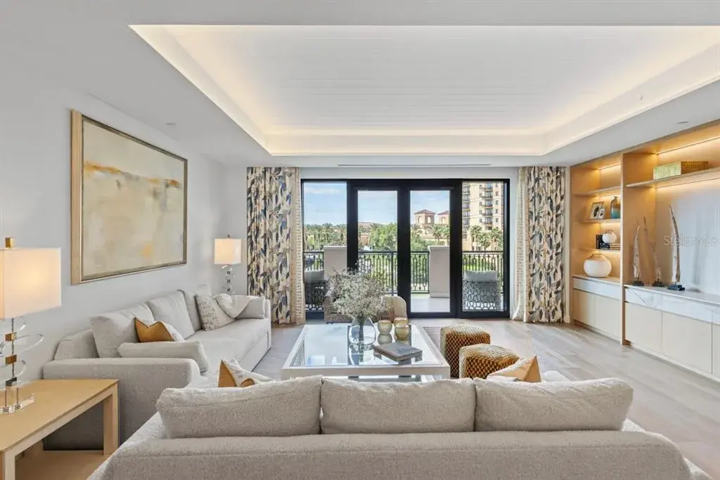 Spacious open concept living room with tongue and groove ceiling details and lighting