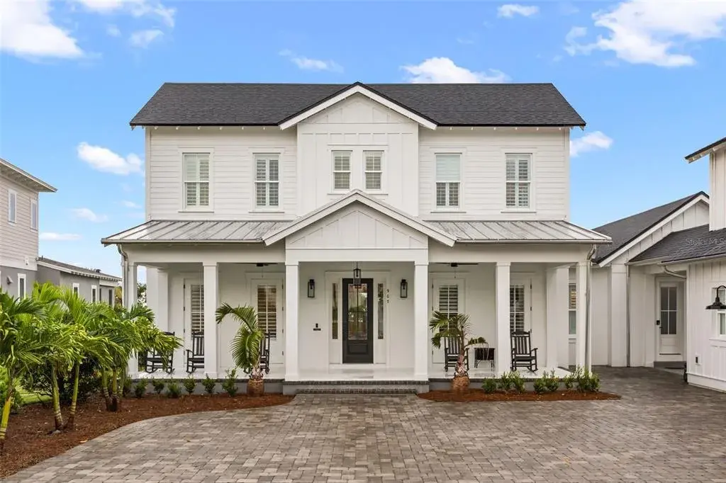 TWO PRIVATE ROOMS OFF THE FOYER Looking toward the front entry, the foyer is framed by double French doors leading to a dedicated executive office on one side and a flexible en suite guest or au pair room on the other