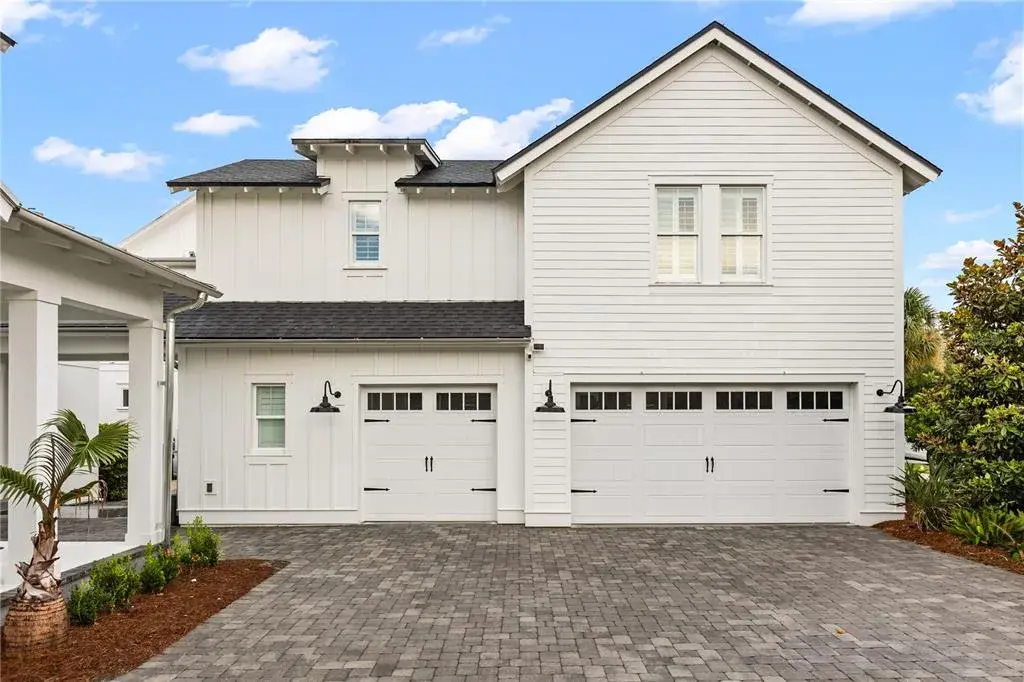 EXPANSIVE KITCHEN + DININGAn oversized center island anchors the gourmet kitchen, with abundant cabinetry and an open dining area designed to accommodate a large table and effortless entertaining.