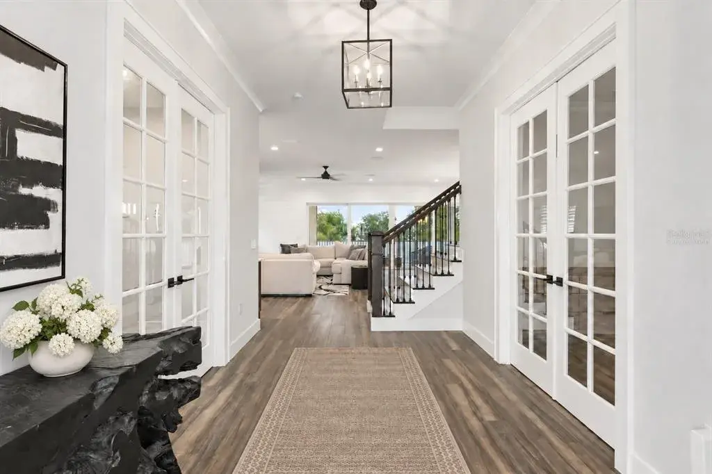 DEDICATED HOME OFFICE | MEETING SPACE.Just off the foyer, a private home office just off the foyer with room for focused work, client meetings or a substantial executive setup.