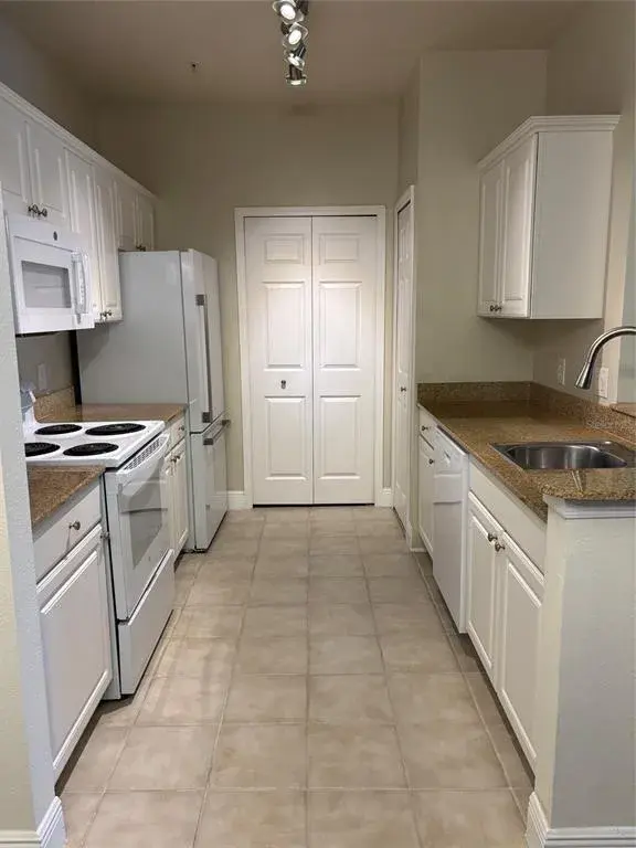 Kitchen with laundry closet at the end