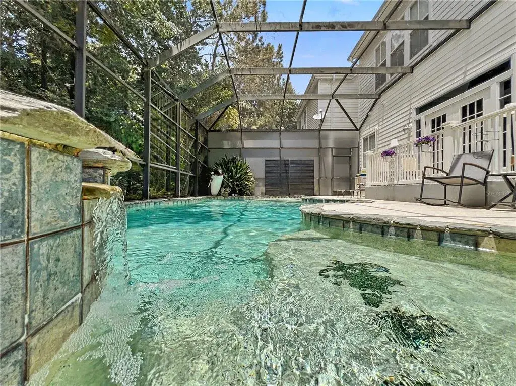 Decorative platforms with turtle designs by waterfall spa