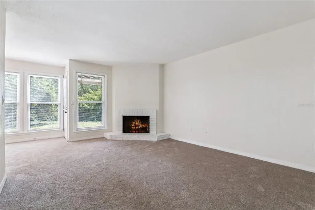 Family Room with fireplace and views.