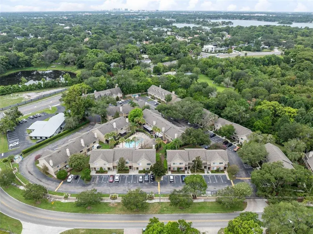 Sandlewood Creek is a quiet, established community with a community pool and one assigned parking space. Maitland Community Park is located directly behind the community and connects to additional park space, offering convenient access to trails and outdoor recreation. Schools are nearby, and Park Avenue and Downtown Winter Park are approximately 10 minutes away, putting shopping, dining and entertainment within easy reach.