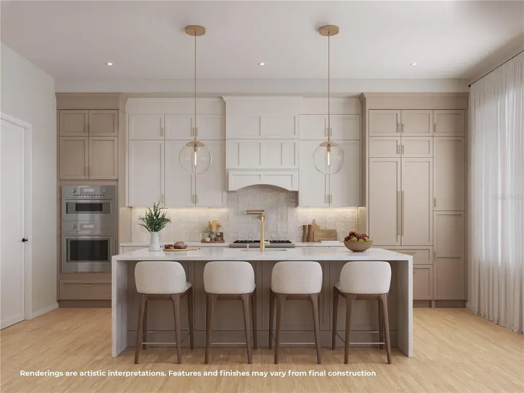 Stunning modern kitchen featuring an oversized center island, abundant cabinetry and a clean, sophisticated design.