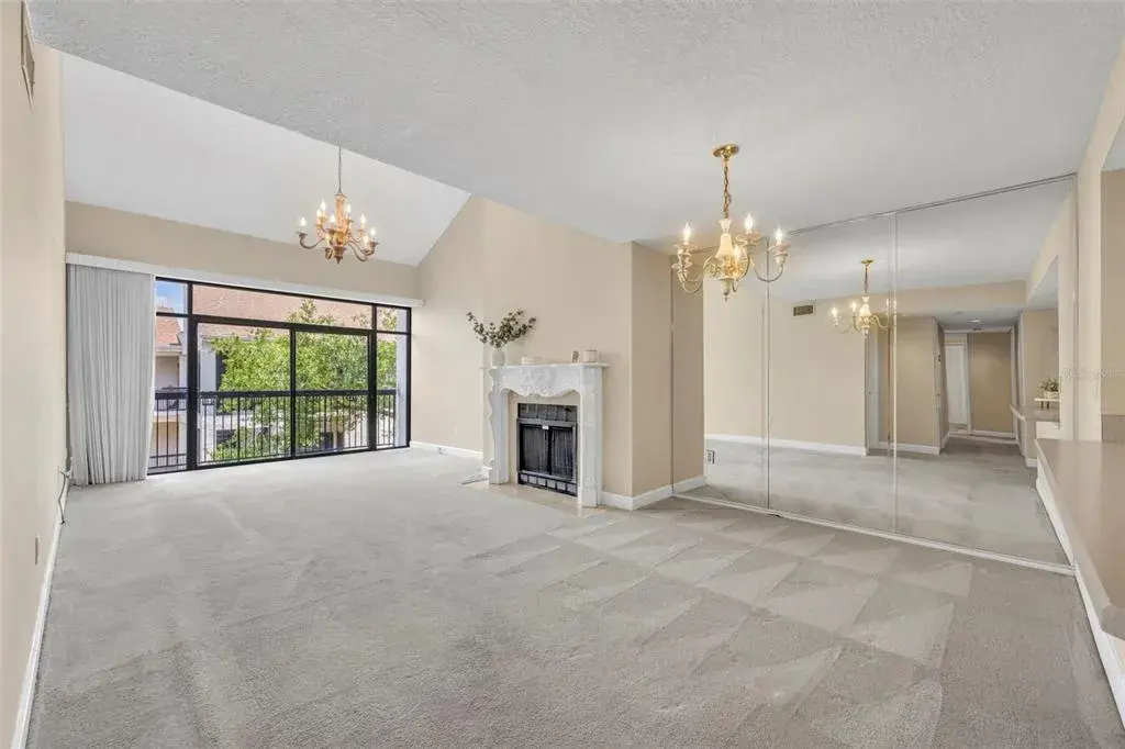The top-floor location means natural light fills the large living room with additional windows along the vaulted ceiling!