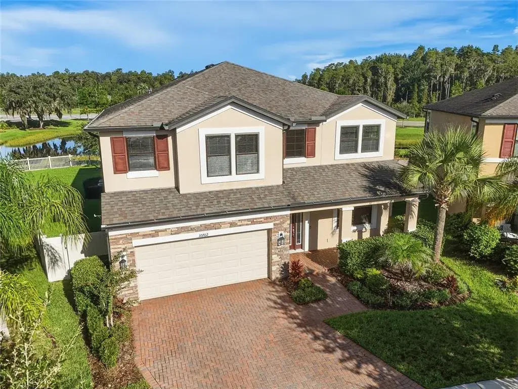 Two Story Foyer with Formal Dining room and Butler's Pantry leading to the Kitchen