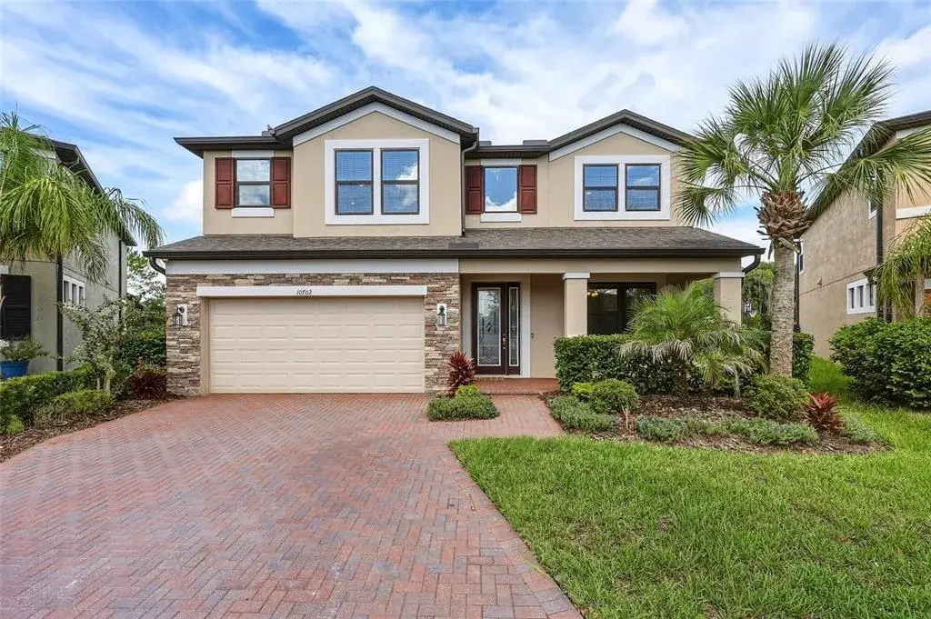 Exterior with paver driveway and covered front porch