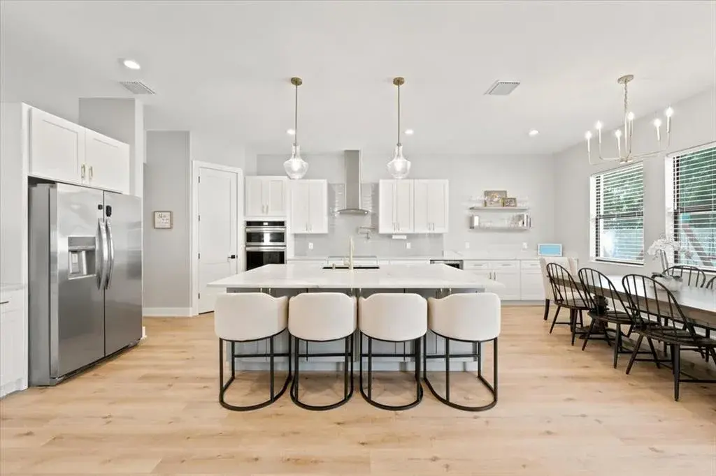 Huge kitchen serves as the centerpiece of the home's main living spaces.