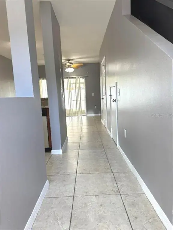 Entryway with kitchen on left side