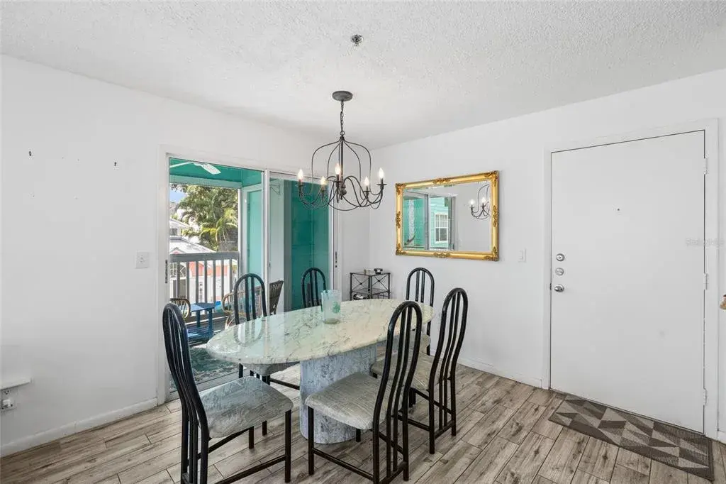 Dining room overlooking balcony & pool area