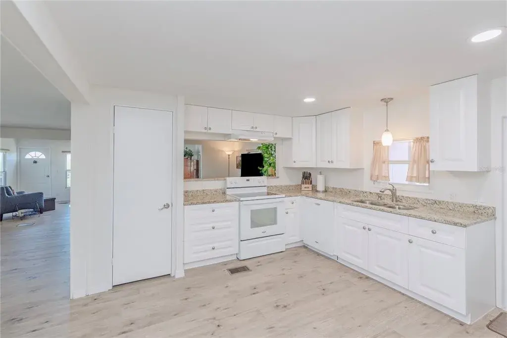 Kitchen with granite counters.