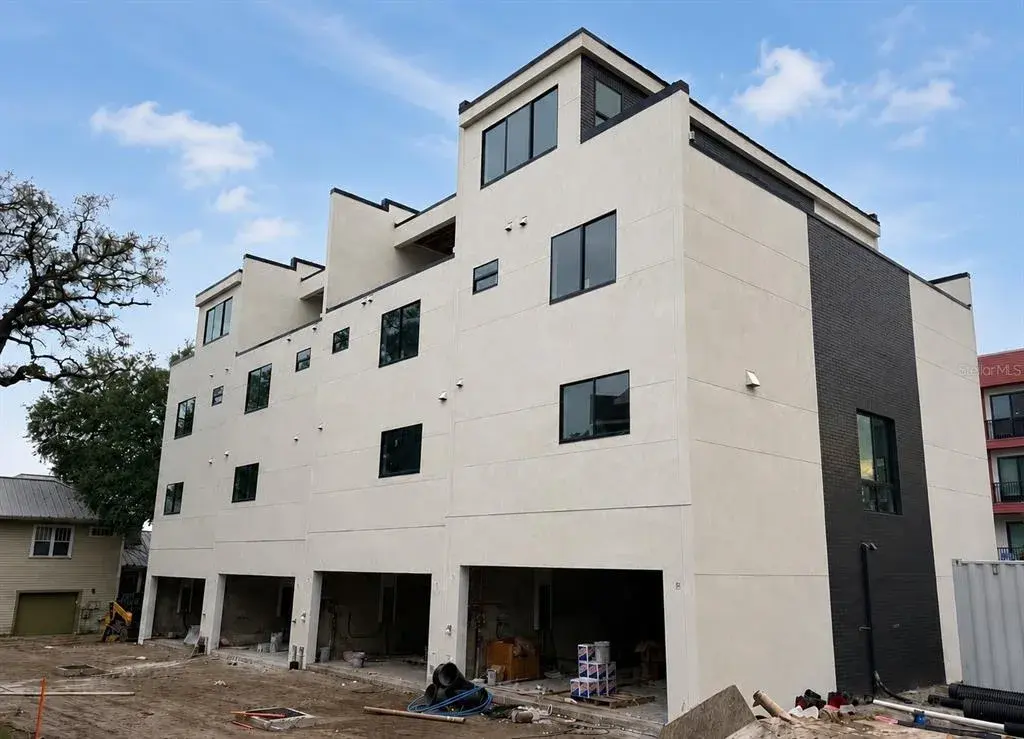 Wide drive with 2 car garage for each unit.