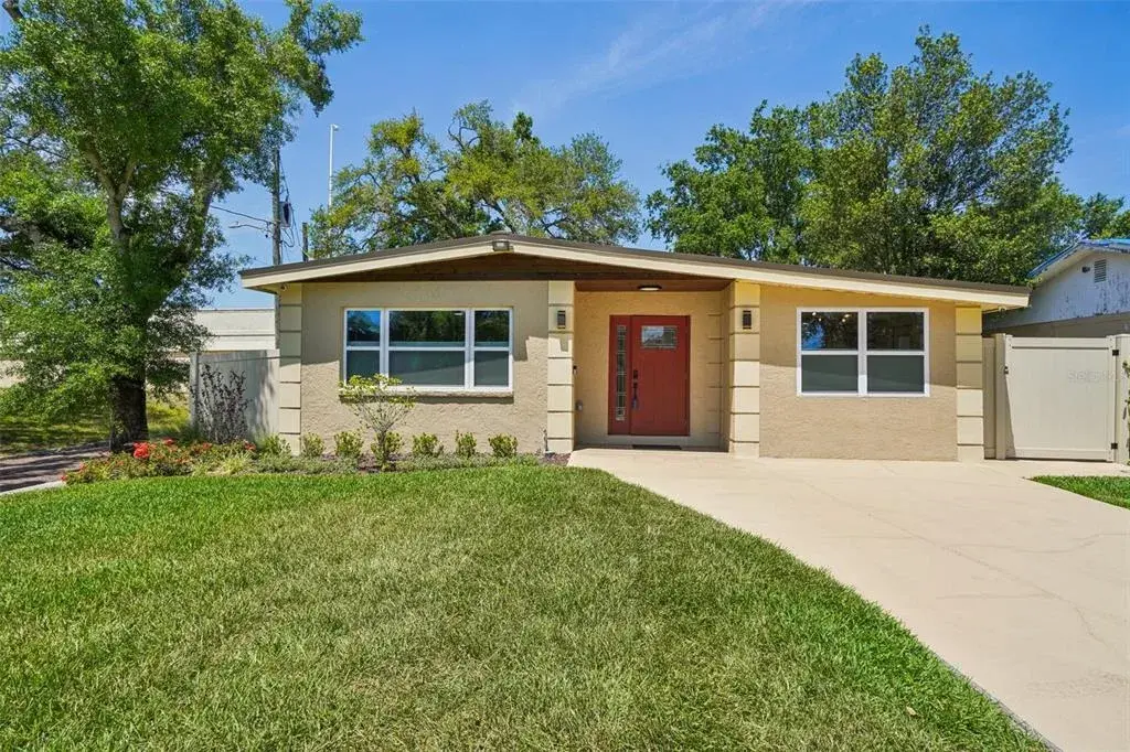 House features 50 year steel roof, maintenance free eaves and soffits, impact windows and doors woth cedar accents