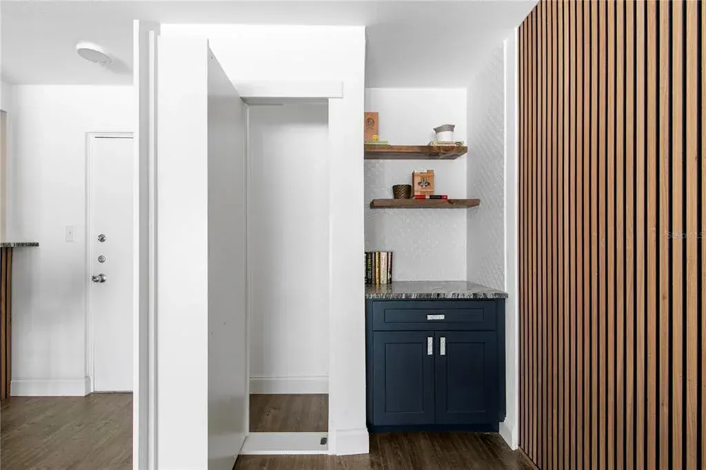 Bookshelf with hidden storage closet, Dry Bar with floating shelves