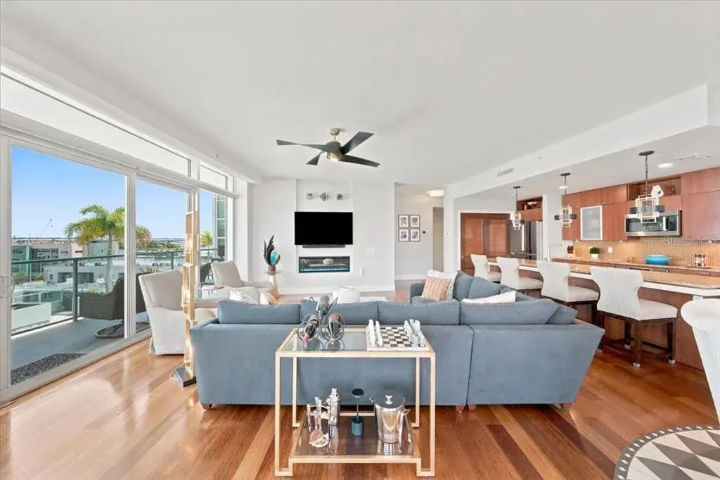 Beautiful wood flooring flows throughout the spacious main living areas.