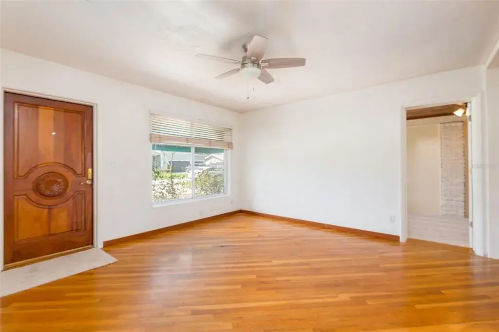 Front door is solid mahogany. Living room has entrance to bonus room.