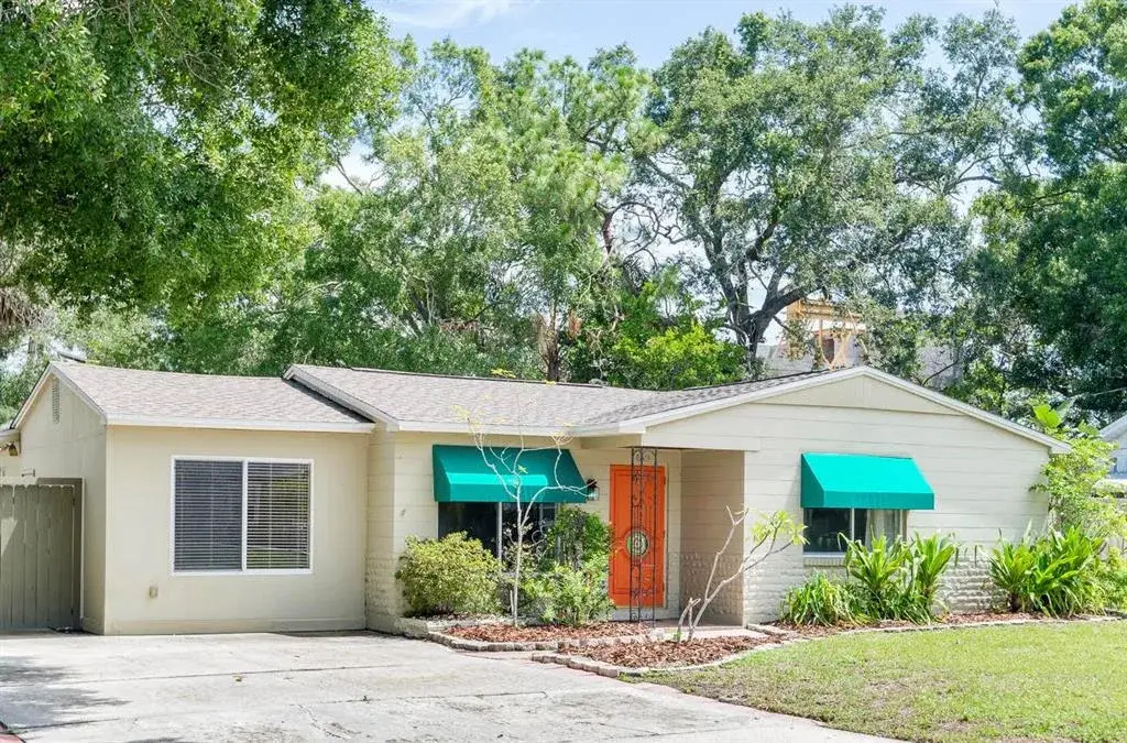 Home is located in a well-established neighborhood with mature trees.