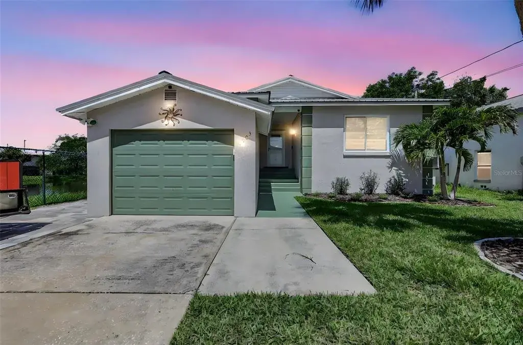 Charming curb appeal with a one-car oversized garage, fresh exterior paint, and well-maintained landscaping.