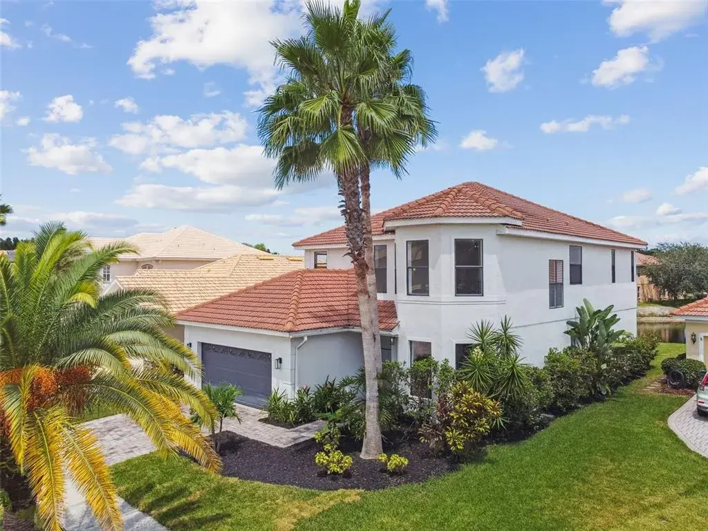 Comtemporary waterfront home in desirable Cory Lake Isles!