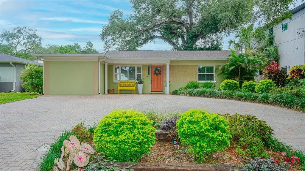 Home front with beautifully landscaped yard
