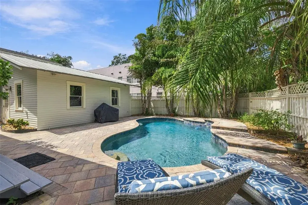 Garage with Alley access & Pool with waterfall!