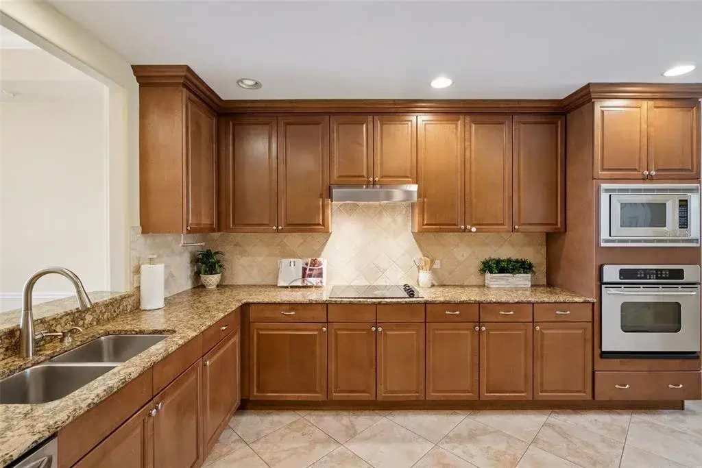 Kitchen with wood cabinetry and granite countertops