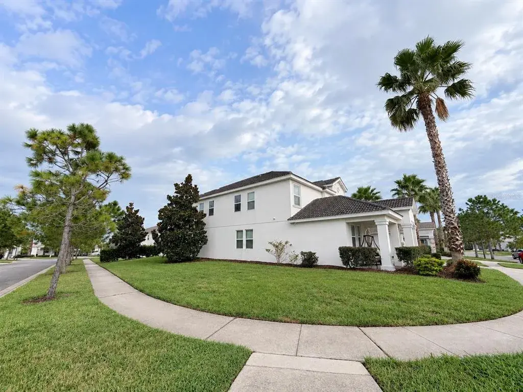 Street view showcasing the home's desirable corner-lot.