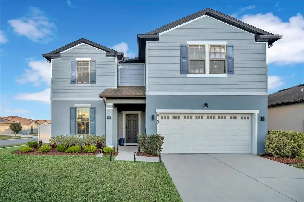 Move-in ready CORNER-LOT in Davenport Florida with spacious yard and attractive curb appeal.