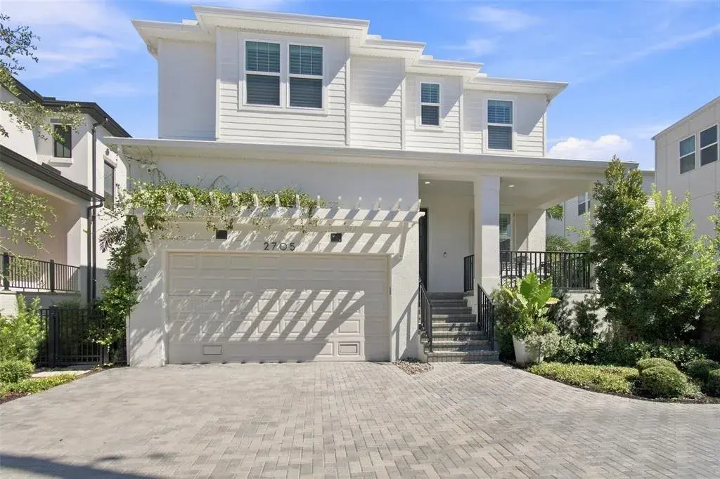 Custom glass front door provides a light filled entry.