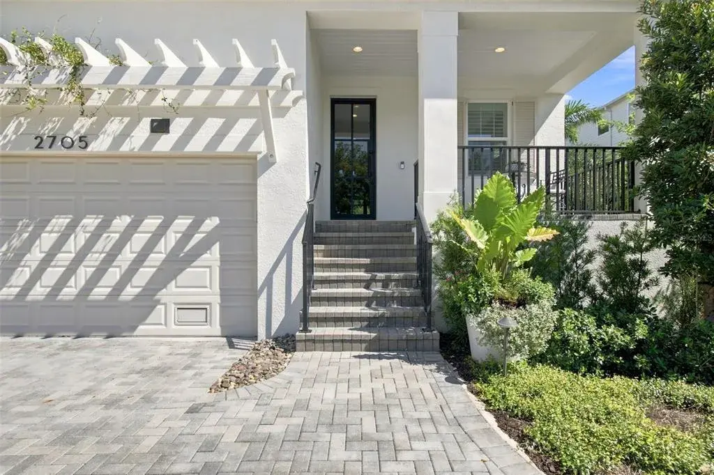 High ceilngs, wood floors, crown molding carry throughout the home