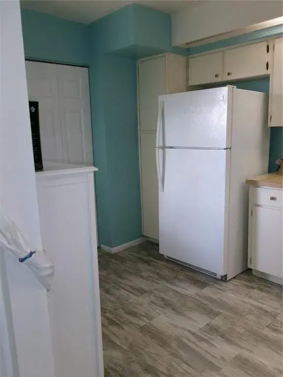 Clean Kitchen as you enter. Lots of cabinets. Freshly painted.