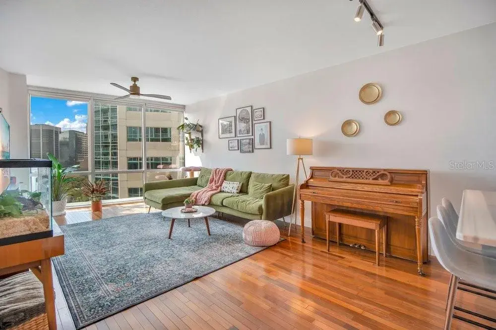 Living & Dining Space, Solid Wood Flooring and Balcony Access.