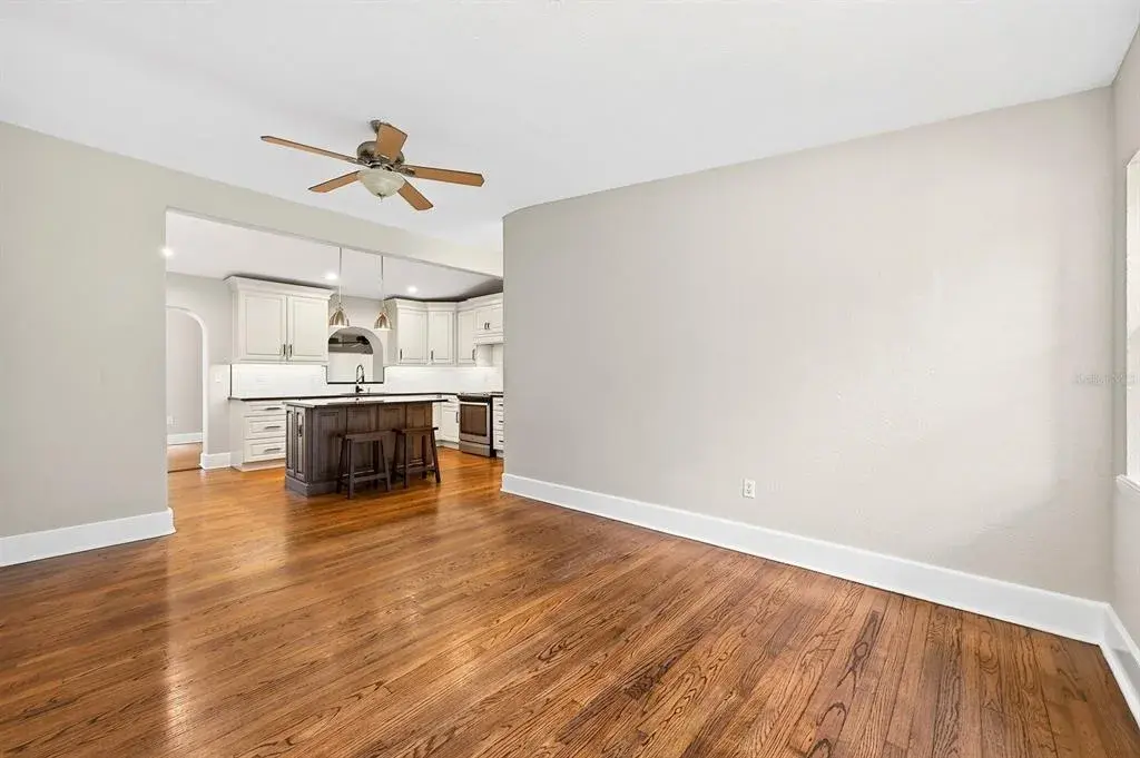 Formal living at the front of the home flows into the updated kitchen.