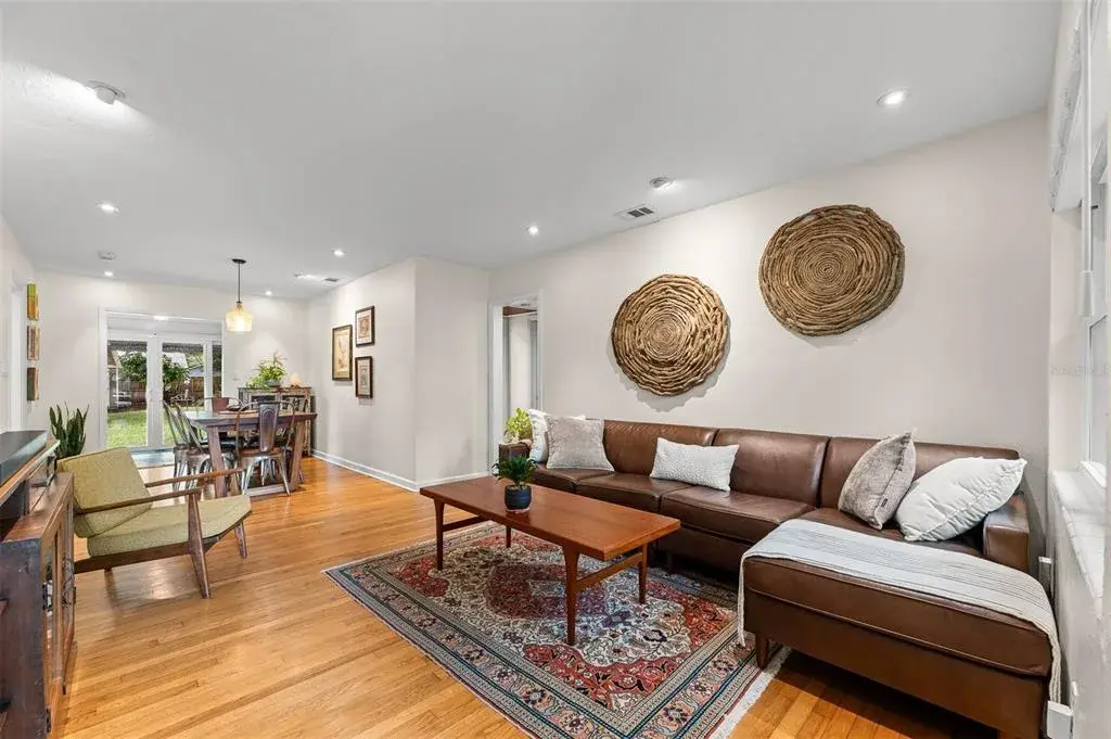 Living Room open to  Dining Room with original hardwood floors