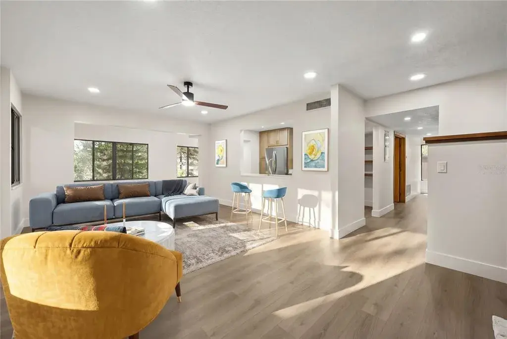 virtually staged living room looking towards dining area