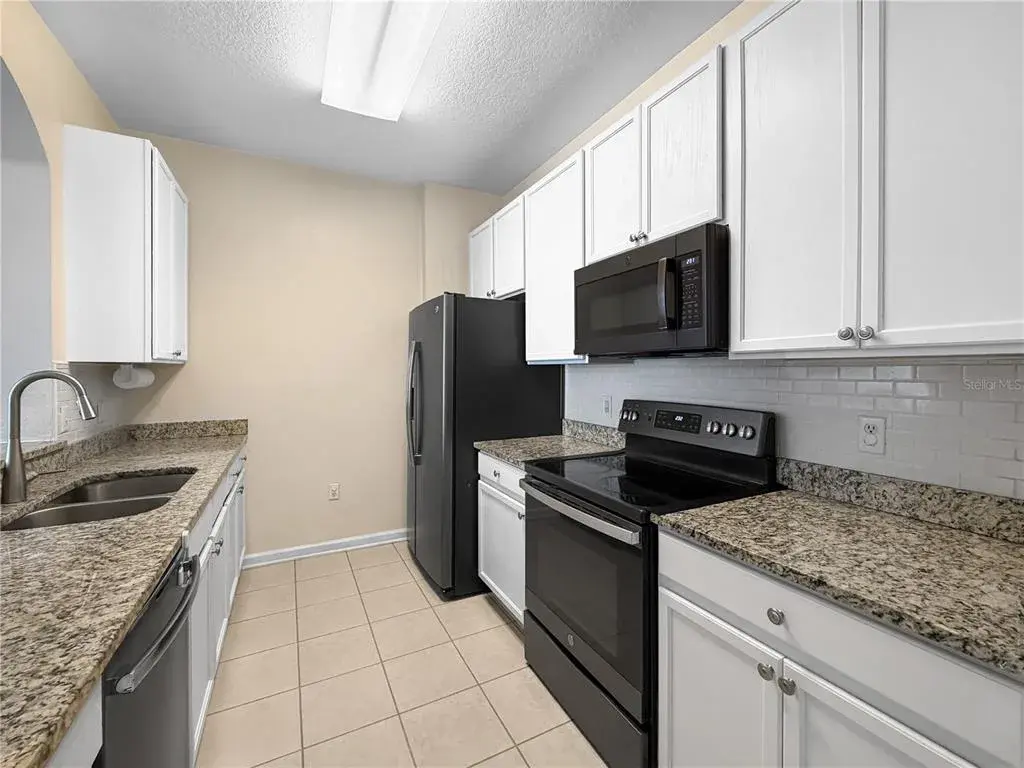 Updated kitchen with granite counters.