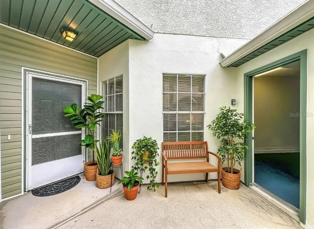 Courtyard view with garage door opened.