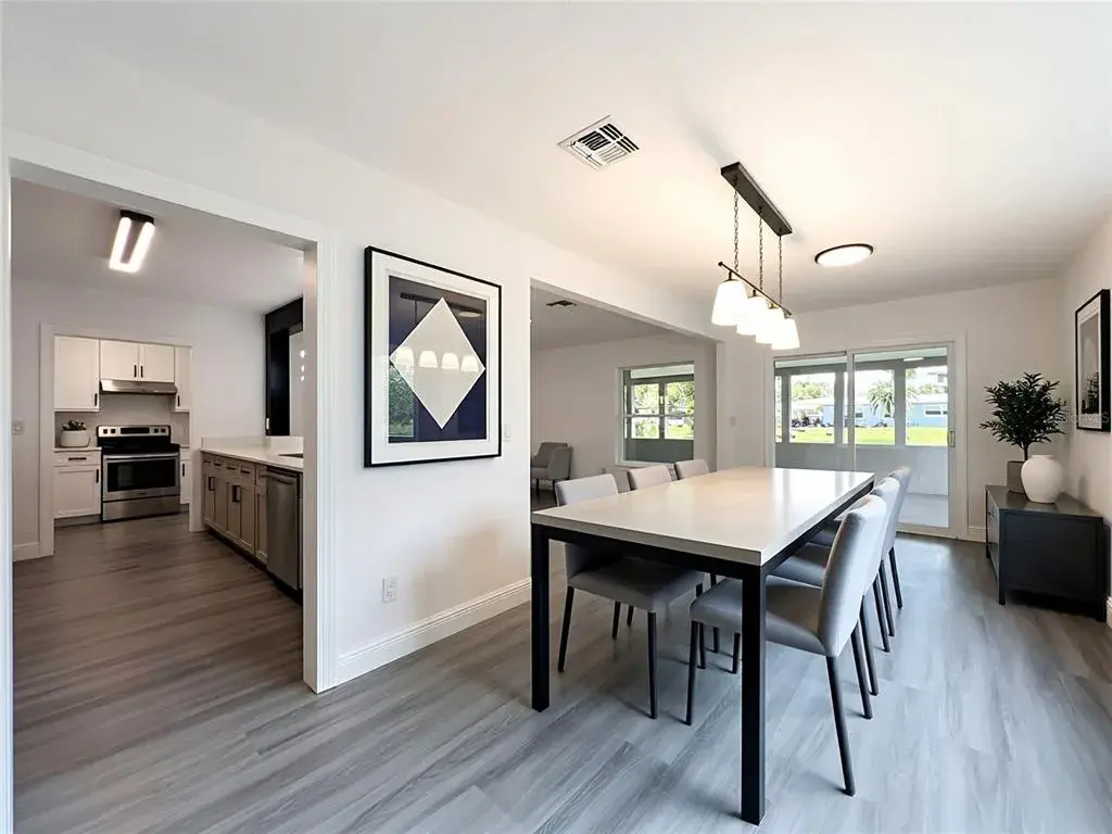 Imagine gathering here—an open layout connecting the living, dining and kitchen areas.
