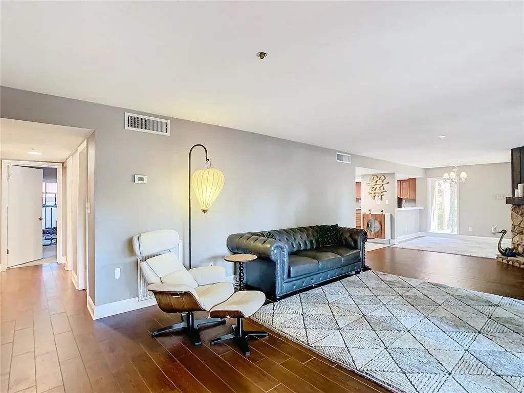 Living area with view down hall of bedrooms