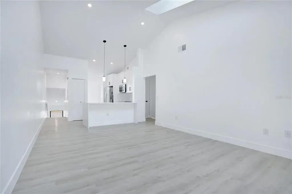 Vaulted ceilings enhance the spacious and airy feel of the main living area.