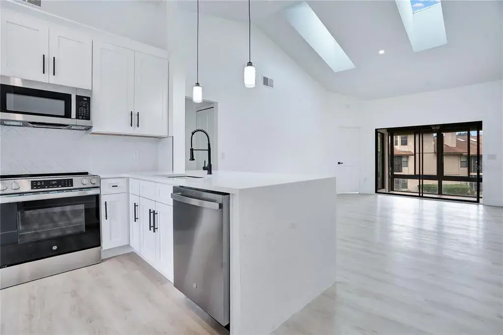 Open-concept kitchen flows seamlessly into the main living area.