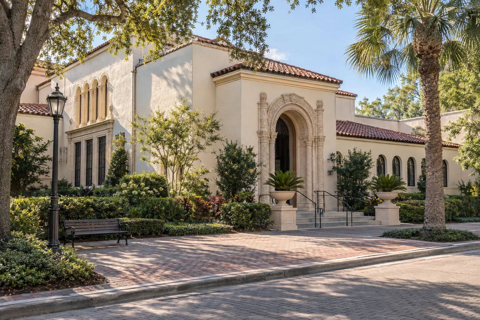 Illustrative exterior view of the Charles Hosmer Morse Museum of American Art, framed by greenery along North Park Avenue in Winter Park.