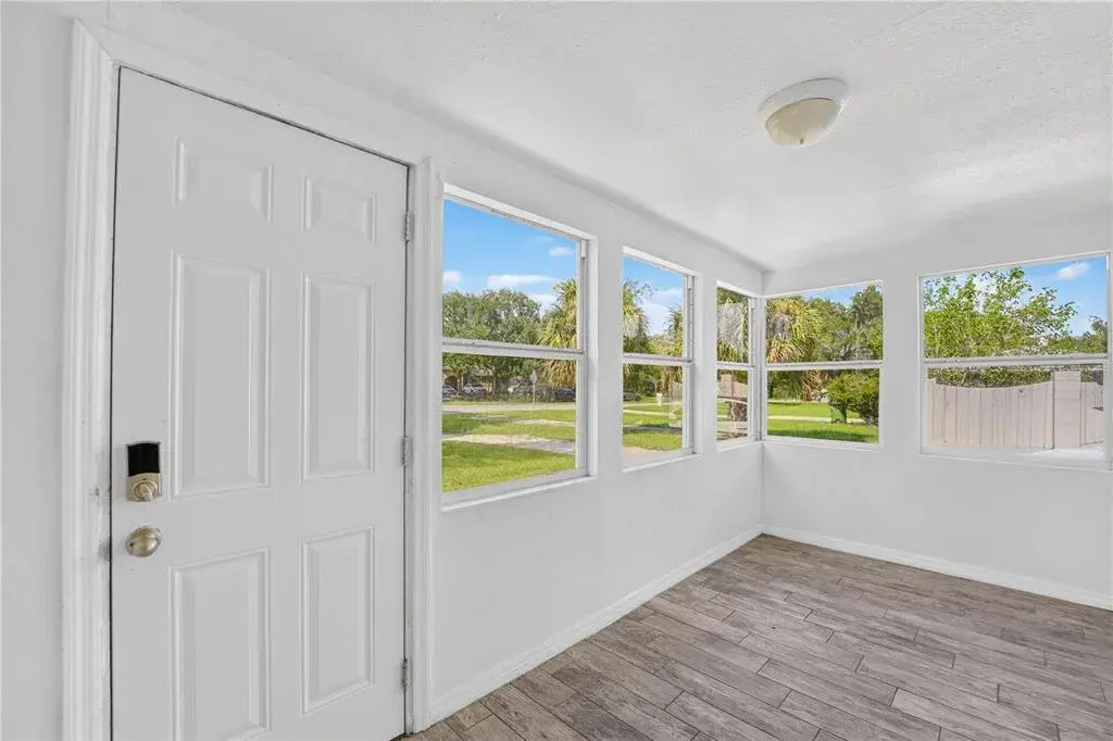 As you enter the main portion of the home, you’re welcomed by a bright FRONT BONUS ROOM surrounded by windows that fill the space with natural light.